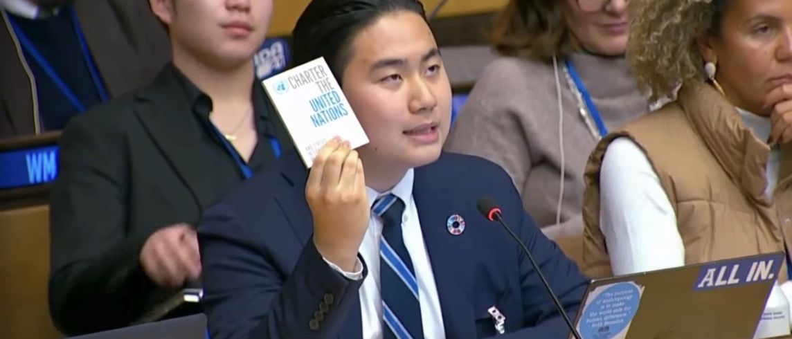Jaewon Choi holding the UN Charter while speaking from the floor at the High-Level Political Forum